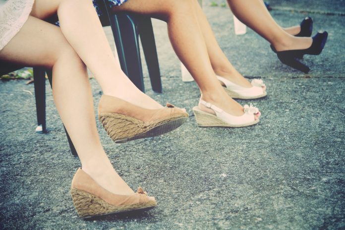 pair of brown leather wedge sandals
