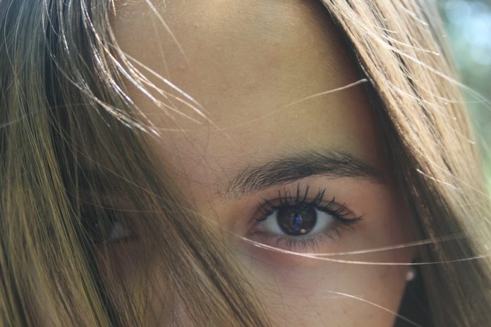 a close up of a person with long hair